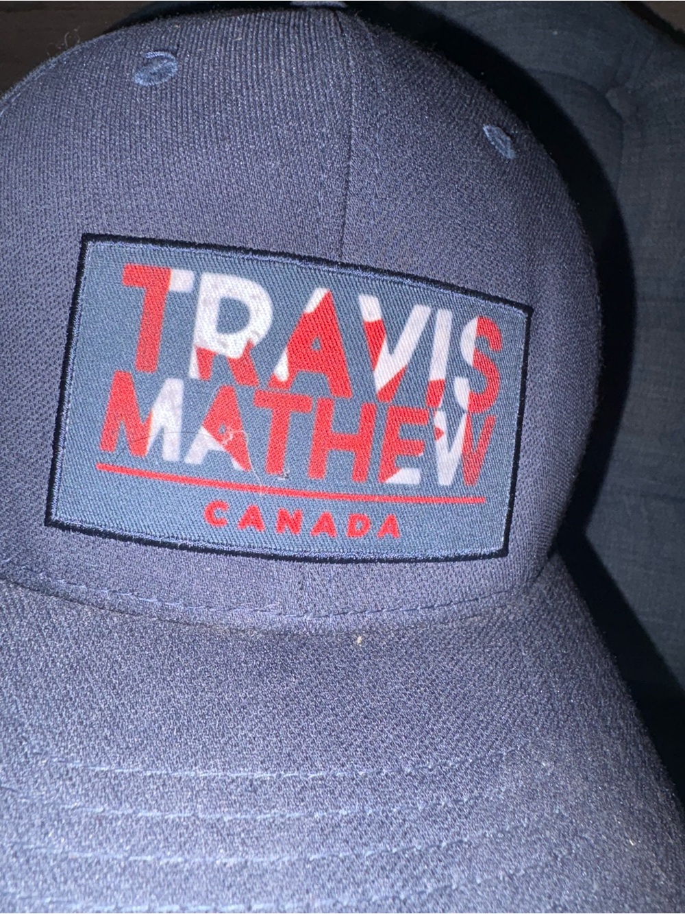 Travis Mathew Navy Hat with Red Logo Patch - Picture 3 of 5